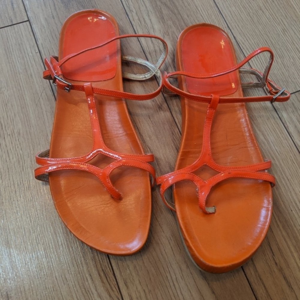 Stuart Weitzman orange flat sandals